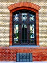 brick exterior elevation frontal view detail with arched window and reflecting glass