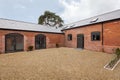 Brick facade of barn renovated to provide new homes
