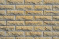 Brick facade tiles, chipped yellow bricks, texture of the facade noisy texture.