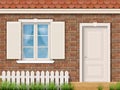 Brick facade with a white window and a door