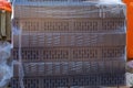 Brick face ceramic hollow single in a pallet covered with a plastic film Royalty Free Stock Photo