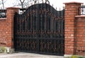 brick fence and forged gate