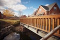 brick footbridge over prairie stream with wooden handrails