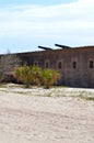 Brick fort with two cannons atop wall