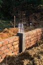 Brick Foundation Wall with Vertical Reinforcement Bars Royalty Free Stock Photo
