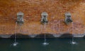 Brick fountain with animal heads Royalty Free Stock Photo