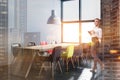 Brick and gray dining room corner, woman Royalty Free Stock Photo