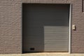 brick grey gate shadow garage wall