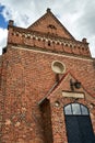 The brick, historic, gothic parish church of St. Nativity of the Blessed Virgin Mary in the village of Kamionna