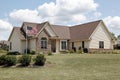 Brick home with American flag Royalty Free Stock Photo