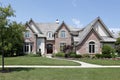 Brick home with cedar roof Royalty Free Stock Photo