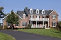 Brick home with front balcony and porch Royalty Free Stock Photo