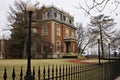 Brick home with iron fence