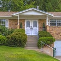 Brick home with stairs and double front doors Royalty Free Stock Photo