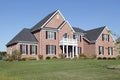 Brick home with white balcony Royalty Free Stock Photo