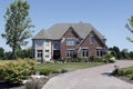 Brick home with white stone turret Royalty Free Stock Photo