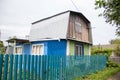 brick house in blue with a wooden second floo Royalty Free Stock Photo