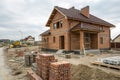 Brick house construction project with building background Royalty Free Stock Photo