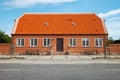 Brick house in Denmark on the road Royalty Free Stock Photo
