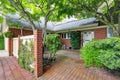 Brick house exterior with tile floor front yard Royalty Free Stock Photo