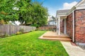 Brick house exterior with walkout wooden deck Royalty Free Stock Photo