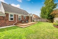 Brick house exterior with walkout wooden deck