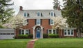 Brick House with Flowering Dogwood Trees