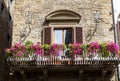 Brick house with flowers and balcony in Florence, Italy Royalty Free Stock Photo