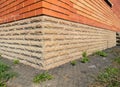 Brick house wall wateproofing with asphalt path