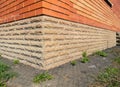 Brick house wall wateproofing with asphalt path Royalty Free Stock Photo
