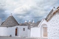 Brick houses trulli in Alberobello. Puglia Italy on a sunny day. UNESCO Cultural Heritage List