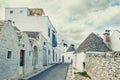 Brick houses trulli in Alberobello. Puglia Italy on a sunny day. UNESCO Cultural Heritage List