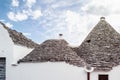 Brick houses trulli in Alberobello. Puglia Italy on a sunny day. UNESCO Cultural Heritage List