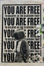 Freedom. The illusion. Street art torn poster