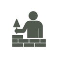 Brick layer tiler mason worker with trowel Royalty Free Stock Photo