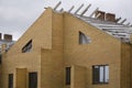 Brick laying brick for the formation of the walls of the building at the construction site. Royalty Free Stock Photo