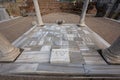 Brick memorial on ground with pillars in Ephesus, Turkey Royalty Free Stock Photo