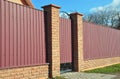 Metal Fence with Door of Modern Style Design from Street Side. Royalty Free Stock Photo