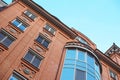 Brick multi-storey building on the background of blue sky Royalty Free Stock Photo