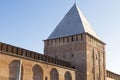 Brick old tower with a pointed roof part of the wall of the Kremlin`s protective structures, an old fort. Russia Smolensk