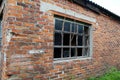 abandoned brick building with an old large window Royalty Free Stock Photo