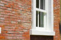 Brick outer wall and white window