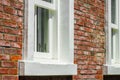 Brick outer wall and white window