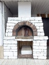 A brick oven with a stone chimney Royalty Free Stock Photo