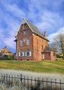 Brick parsonage against cloudy blue sky, Ravels, Flanders, Belgium Royalty Free Stock Photo