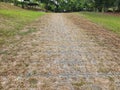 Brick Pathway Through Rustic Park Landscape in Natural Surroundings Royalty Free Stock Photo