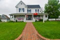 Brick pavement leading to the entrance to a classic American home