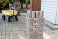 Brick pillars around a wooden gazebo leg Royalty Free Stock Photo