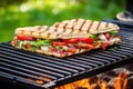 brick-pressed packed sandwich on bbq grill