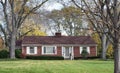 Brick Ranch House in Wooded Setting Royalty Free Stock Photo